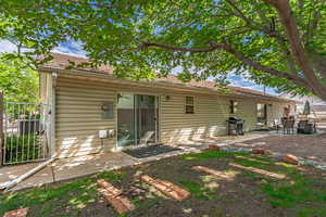 Rear view of house with a patio