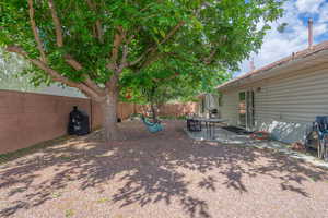 Fenced backyard with a patio area