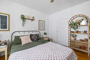 Bedroom featuring wood finished floors and a ceiling fan