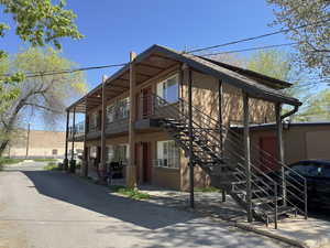 View of property exterior featuring stairway