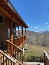 Deck featuring a mountain view and stairs