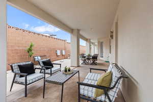 View of patio featuring fence, outdoor lounge area, and outdoor dining area