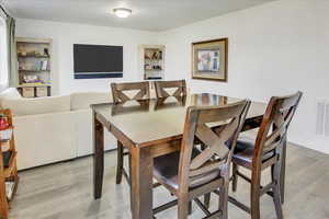 Dining space with light wood finished floors