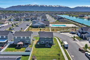 Aerial perspective of suburban area featuring a water and mountain view