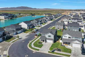 Aerial perspective of suburban area featuring a water and mountain view