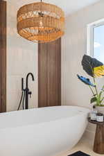 Full bathroom with a freestanding bath