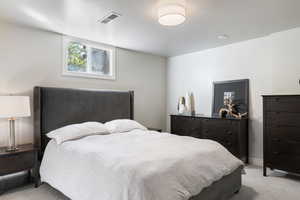Bedroom with light carpet