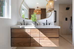 Kitchen with a sink, modern cabinets, light tile patterned floors, healthy amount of natural light, and recessed lighting