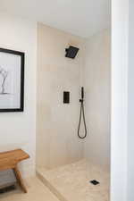 Full bathroom featuring tiled shower