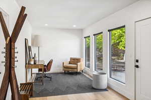 Office area with wood finished floors, recessed lighting, and baseboards