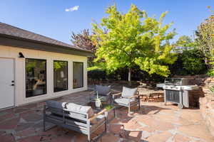 View of patio / terrace featuring a grill and an outdoor living space