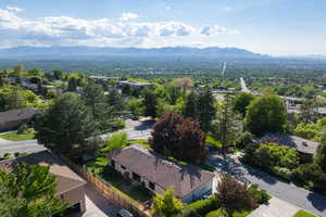 Aerial view of residential area featuring a mountain backdrop