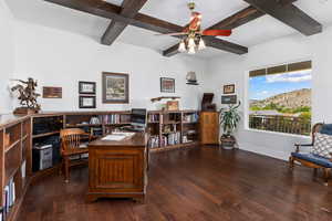 Office area featuring beamed ceiling, coffered ceiling, dark wood-style flooring, and a ceiling fan