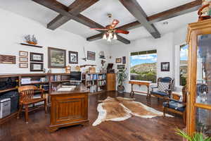 Office featuring ceiling fan, beam ceiling, dark wood-type flooring, and coffered ceiling
