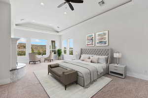 Bedroom featuring a tray ceiling, light colored carpet, ceiling fan, and recessed lighting