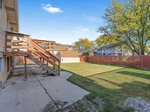 View of yard with a patio area