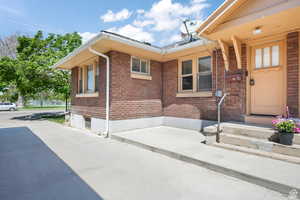 View of side of home featuring brick siding