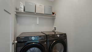 Clothes washing area with washing machine and dryer