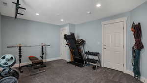 Exercise area featuring recessed lighting, baseboards, and carpet floors