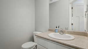 Bathroom featuring toilet and vanity