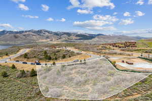 Aerial overview of property's location featuring property boundaries highlighted and mountains