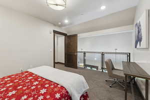 Bedroom with carpet, recessed lighting, and vaulted ceiling