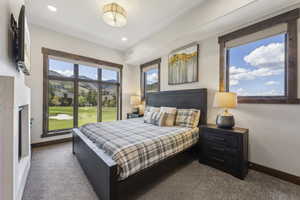 Bedroom with carpet flooring, baseboards, and recessed lighting
