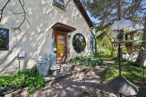 Property entrance with stucco siding