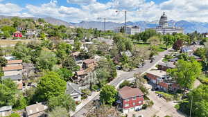 Aerial perspective of suburban area featuring a mountain backdrop