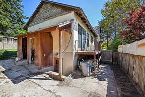 View of home's exterior with a fenced backyard and a patio