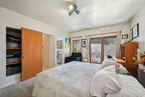 Bedroom with carpet and baseboards