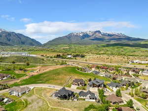 Aerial view of residential area featuring mountains