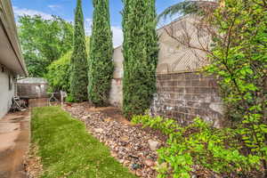 View of yard featuring fence