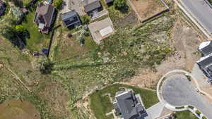 Aerial overview of property's location with nearby suburban area
