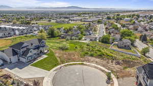 Aerial perspective of suburban area with a mountain backdrop