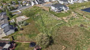View of property location with nearby suburban area and a nearby body of water