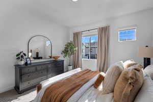 Carpeted bedroom featuring baseboards