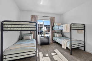 Bedroom with carpet floors and baseboards