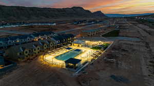 Drone / aerial view of a pool area and a mountain backdrop
