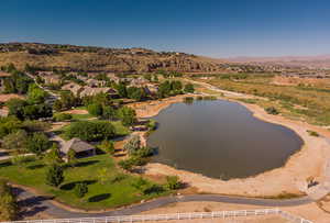 Aerial perspective of suburban area with a water and mountain view