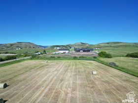 View of mountain backdrop with rural landscape