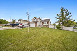 View of front of property with concrete driveway