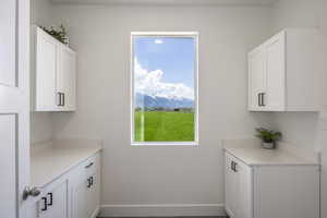 Washroom with a mountain view and baseboards