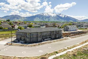View of front of property featuring a mountain view and a residential view