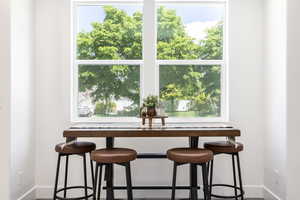 Dining area with healthy amount of natural light and baseboards