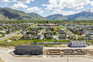 Aerial perspective of suburban area with a mountainous background