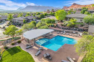 Community pool featuring a residential view, a patio area, and a mountain view