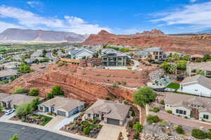 Aerial view of residential area with a mountainous background