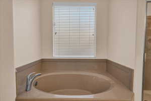 Full bathroom featuring a garden tub