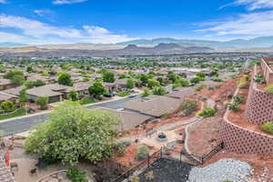 Aerial perspective of suburban area featuring a mountainous background